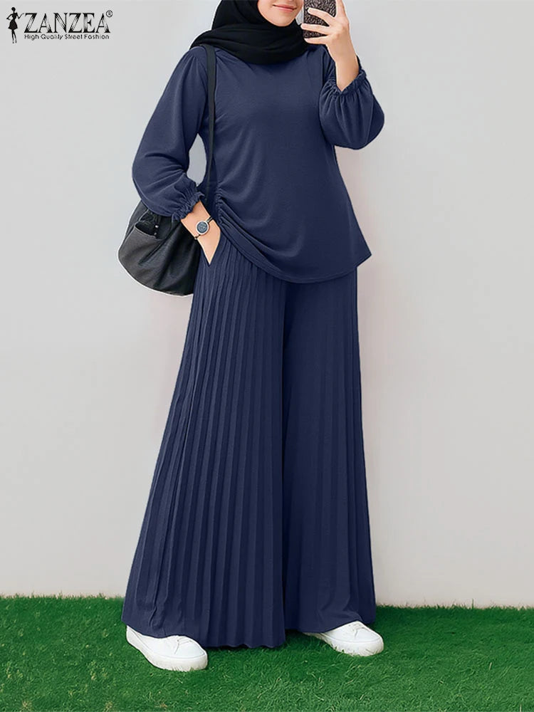 طقم نسائي محتشم قطعتين بتصميم أنيق – بلوزة بأكمام طويلة وبنطال واسع مريح