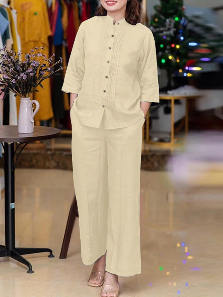 طقم نسائي أنيق قطعتين – بلوزة بأكمام طويلة وياقة واقفة مع بنطال واسع مريح