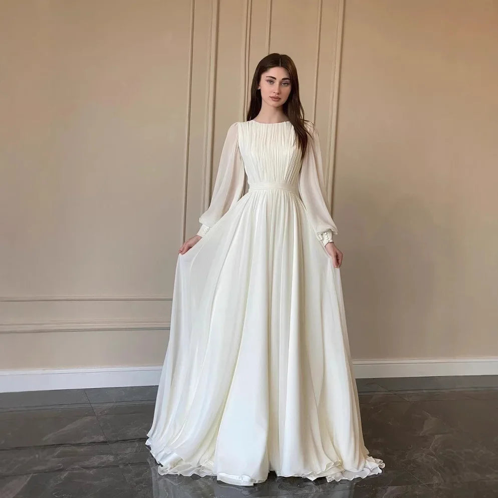 فستان نسائي طويل أنيق بكسرات وأكمام منفوخة – عباية محتشمة بتصميم راقٍ مناسبة لرمضان والمناسبات