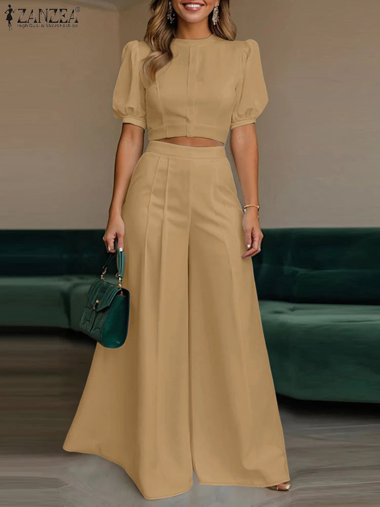 طقم نسائي صيفي أنيق قطعتين – بلوزة قصيرة بأكمام منفوشة مع بنطال واسع