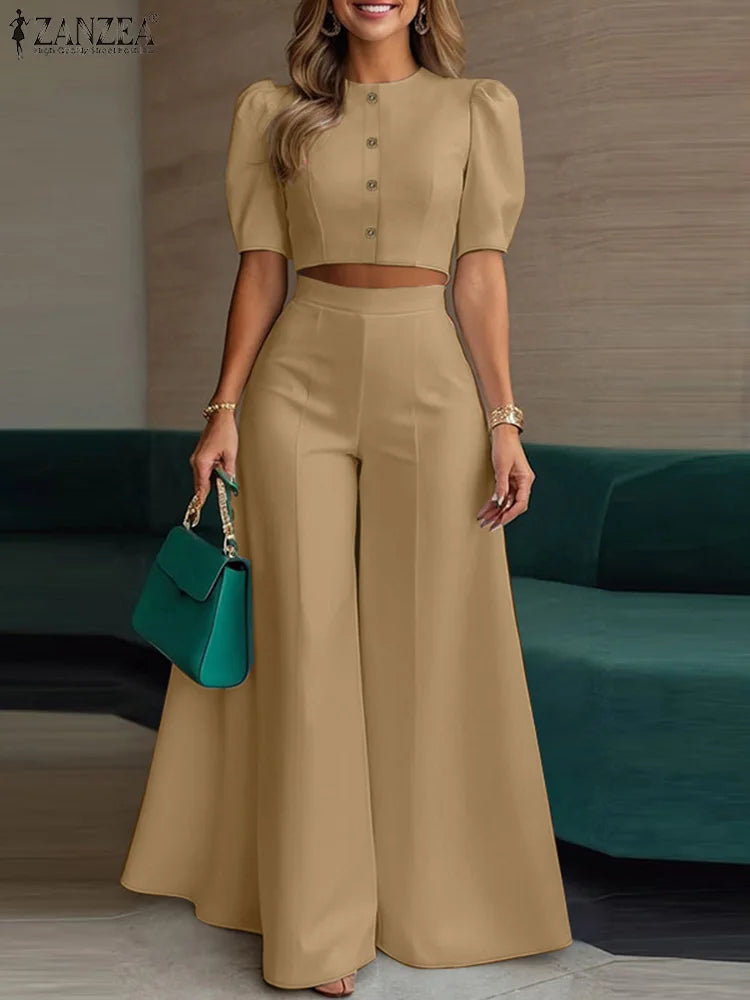 طقم نسائي صيفي أنيق قطعتين – بلوزة قصيرة بأكمام منفوشة مع بنطال واسع