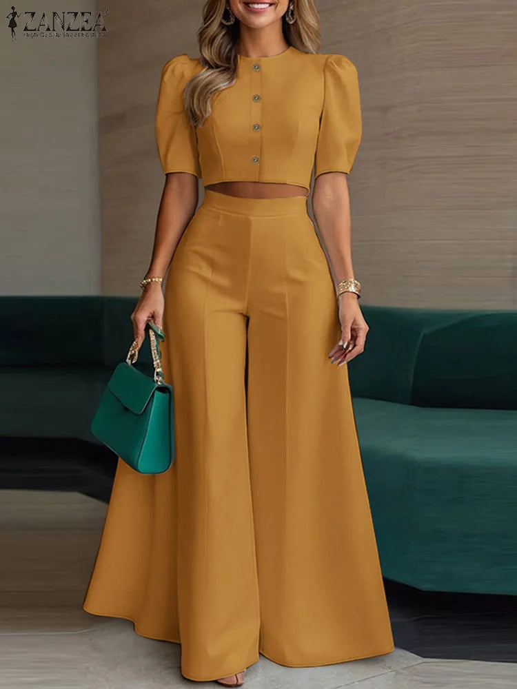 طقم نسائي صيفي أنيق قطعتين – بلوزة قصيرة بأكمام منفوشة مع بنطال واسع