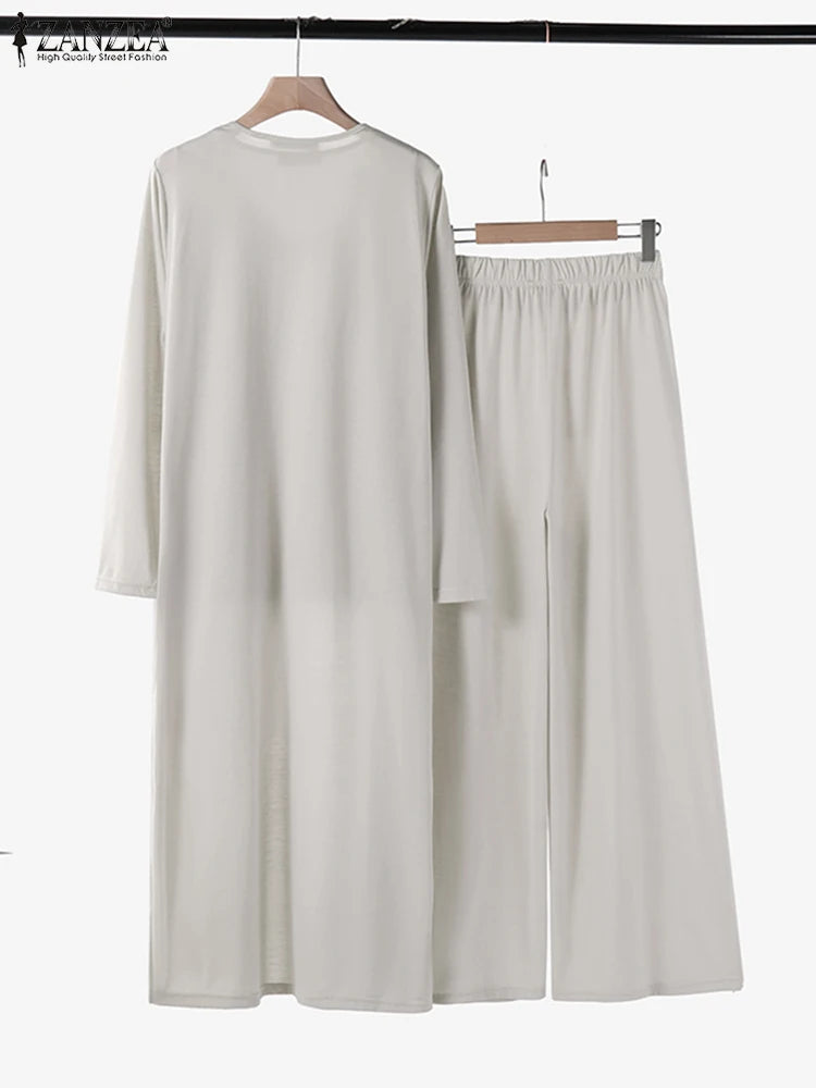 طقم نسائي أنيق ثلاث قطع – توب بدون أكمام مع كارديجان طويل وبنطال واسع مريح