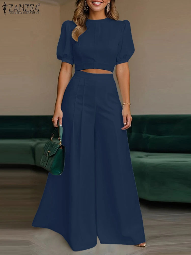 طقم نسائي صيفي أنيق قطعتين – بلوزة قصيرة بأكمام منفوشة مع بنطال واسع