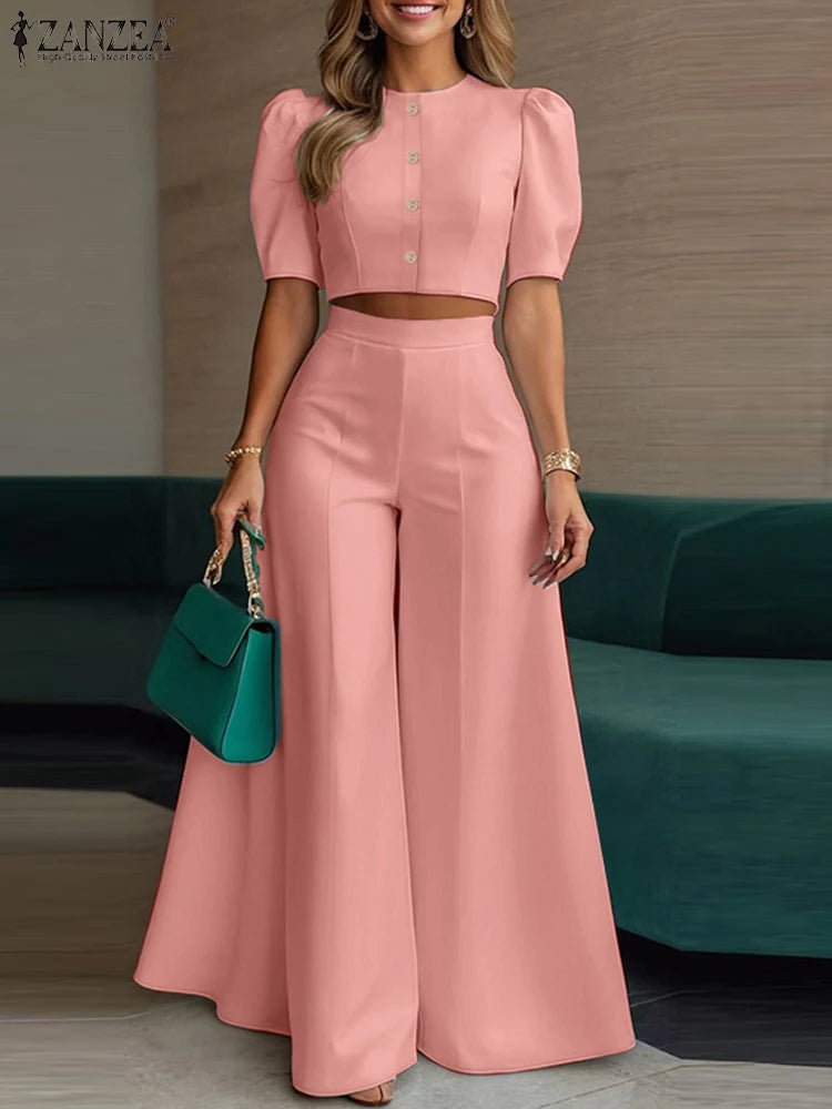 طقم نسائي صيفي أنيق قطعتين – بلوزة قصيرة بأكمام منفوشة مع بنطال واسع