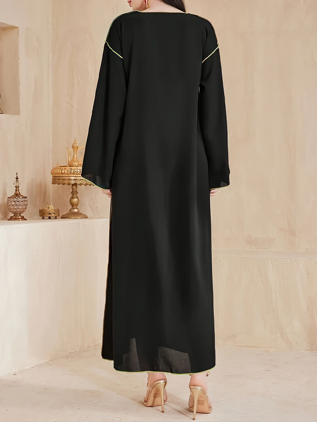 A Mid-Length Dress with a V-Neck, Flared Sleeves, And Slit Design, Featuring Elegant And Luxurious Heat Transfer Craftsmanship, Suitable for The Eid Celebration, Resembling a Traditional Abaya